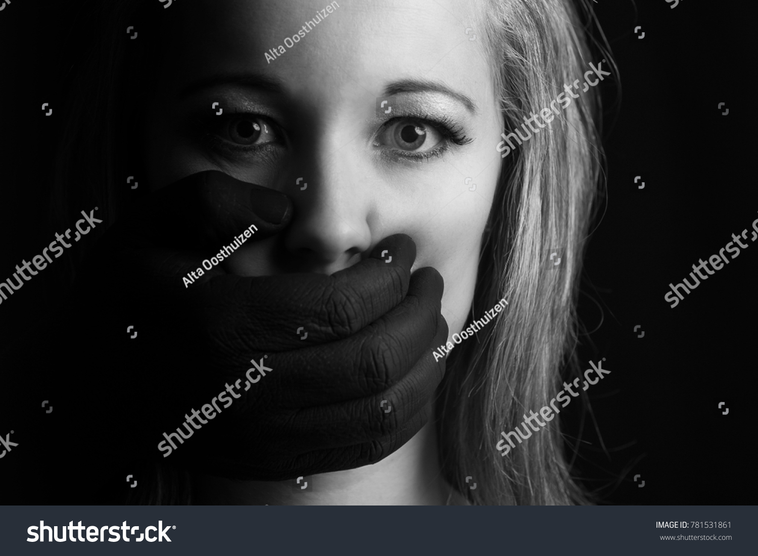 Frightened Blonde Woman Grabbed By Black Stock Photo