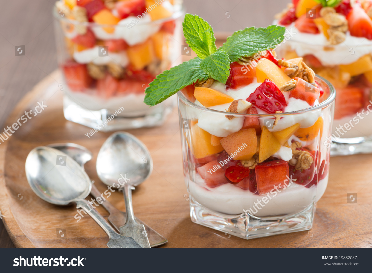 http://image.shutterstock.com/z/stock-photo-fruit-dessert-with-whipped-cream-mint-and-granola-close-up-horizontal-198820871.jpg