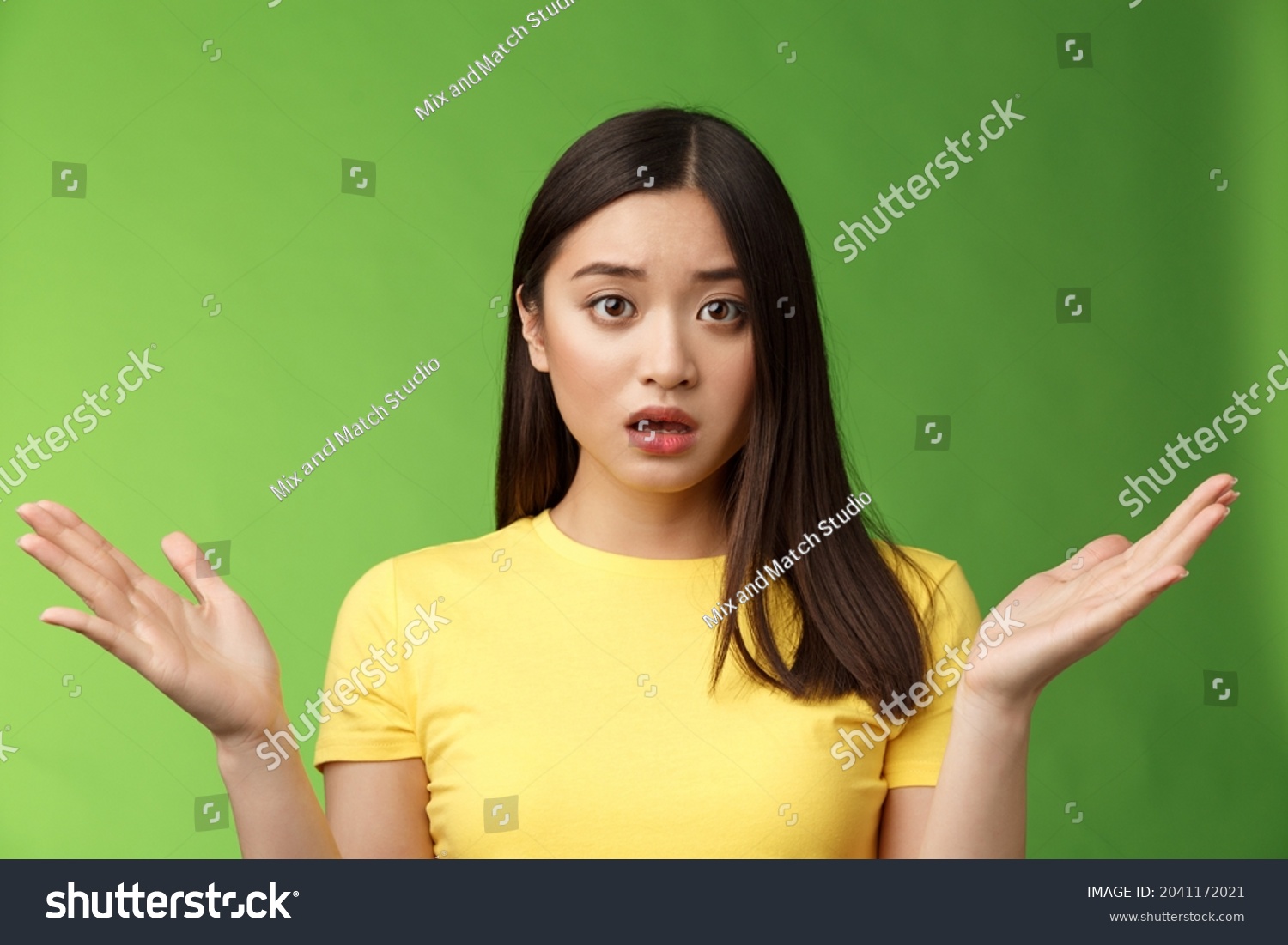 5 Frustrated asian girl shrugging looking worried Images, Stock Photos ...