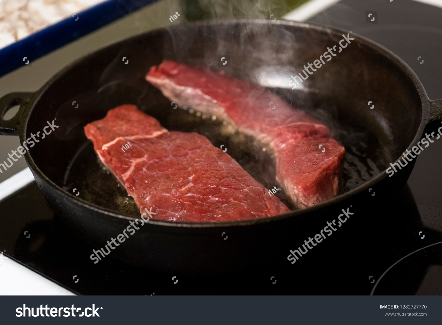 Frying Beef Steaks On Cast Iron Stock Photo Edit Now 1282727770