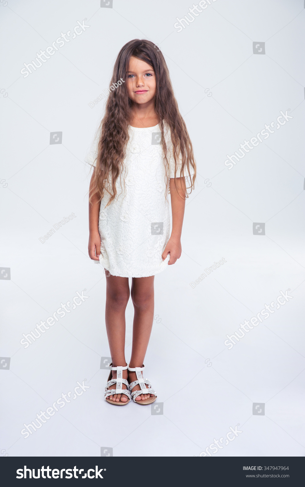 Full Length Portrait Of A Pretty Little Girl In Dress Standing Isolated ...
