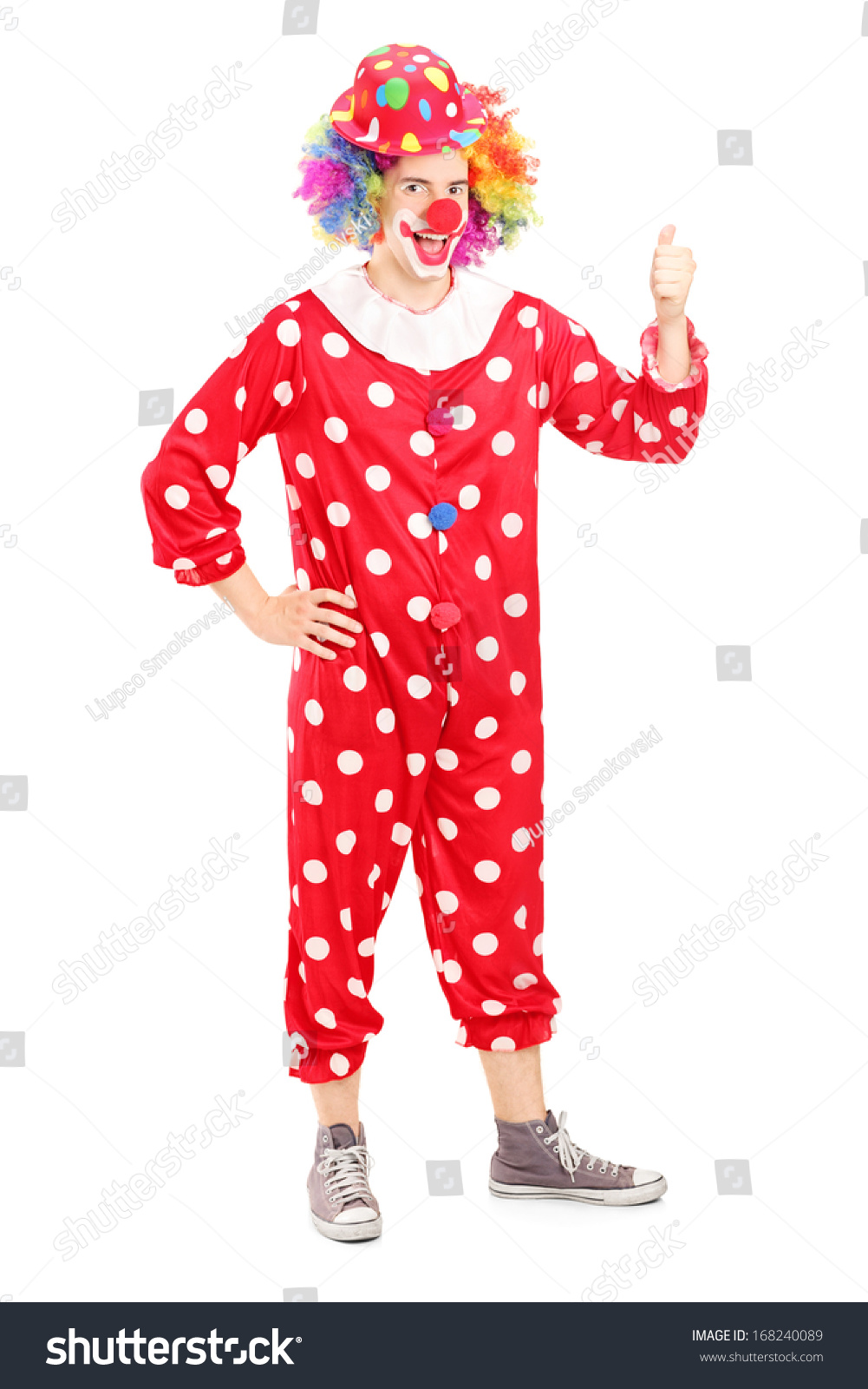 Full Length Portrait Of A Smiling Happy Clown In Red Costume Giving ...