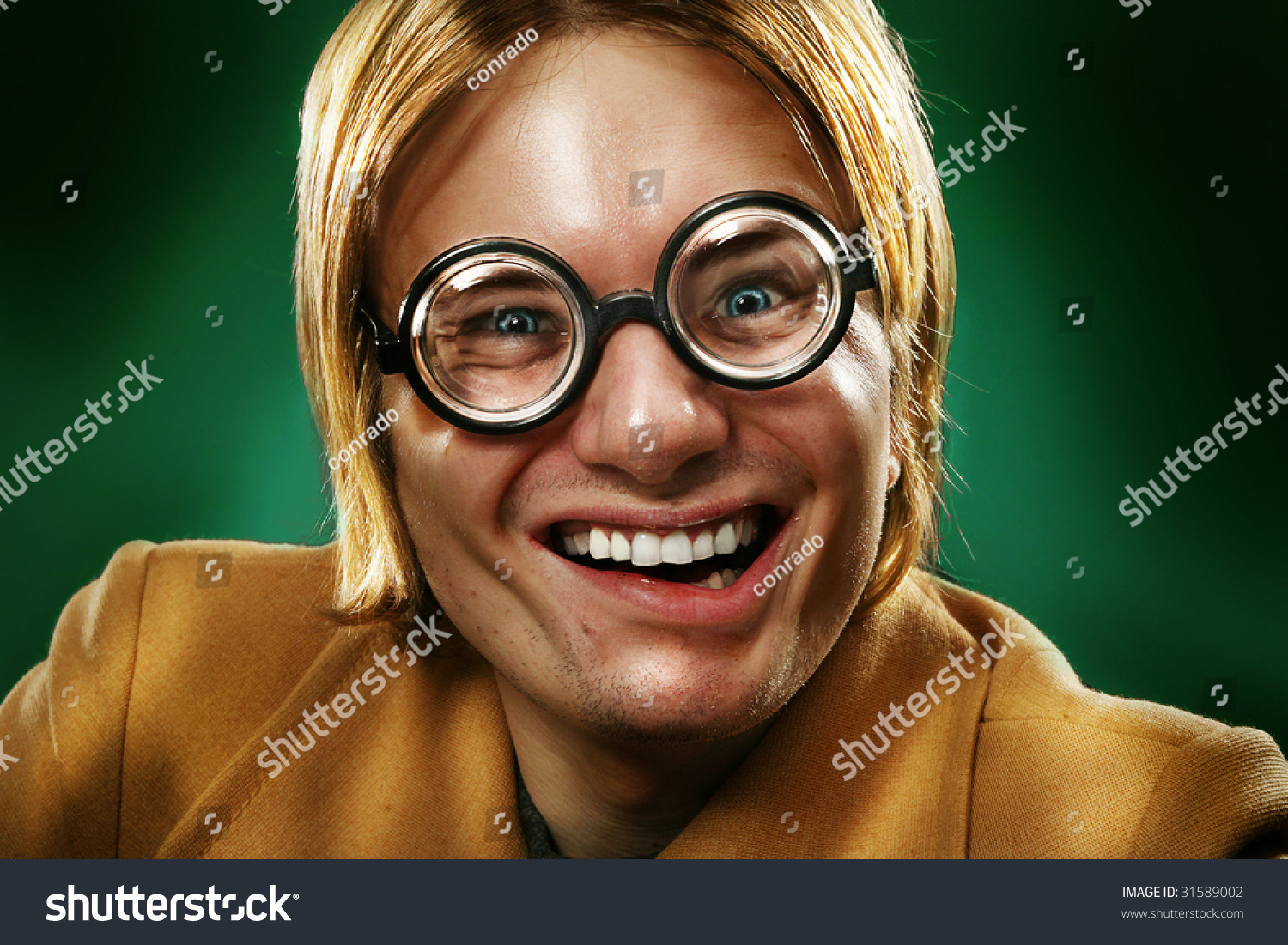 stock-photo-funny-guy-grimacing-over-green-background-31589002.jpg