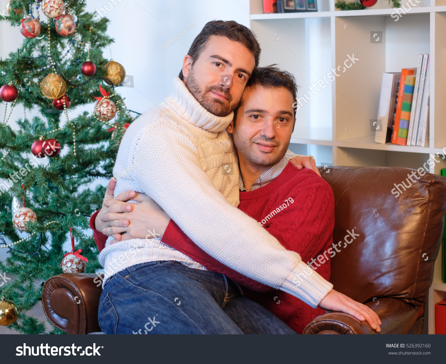 stock-photo-gay-couple-of-men-embracing-during-christmas-time-526392160.jpg