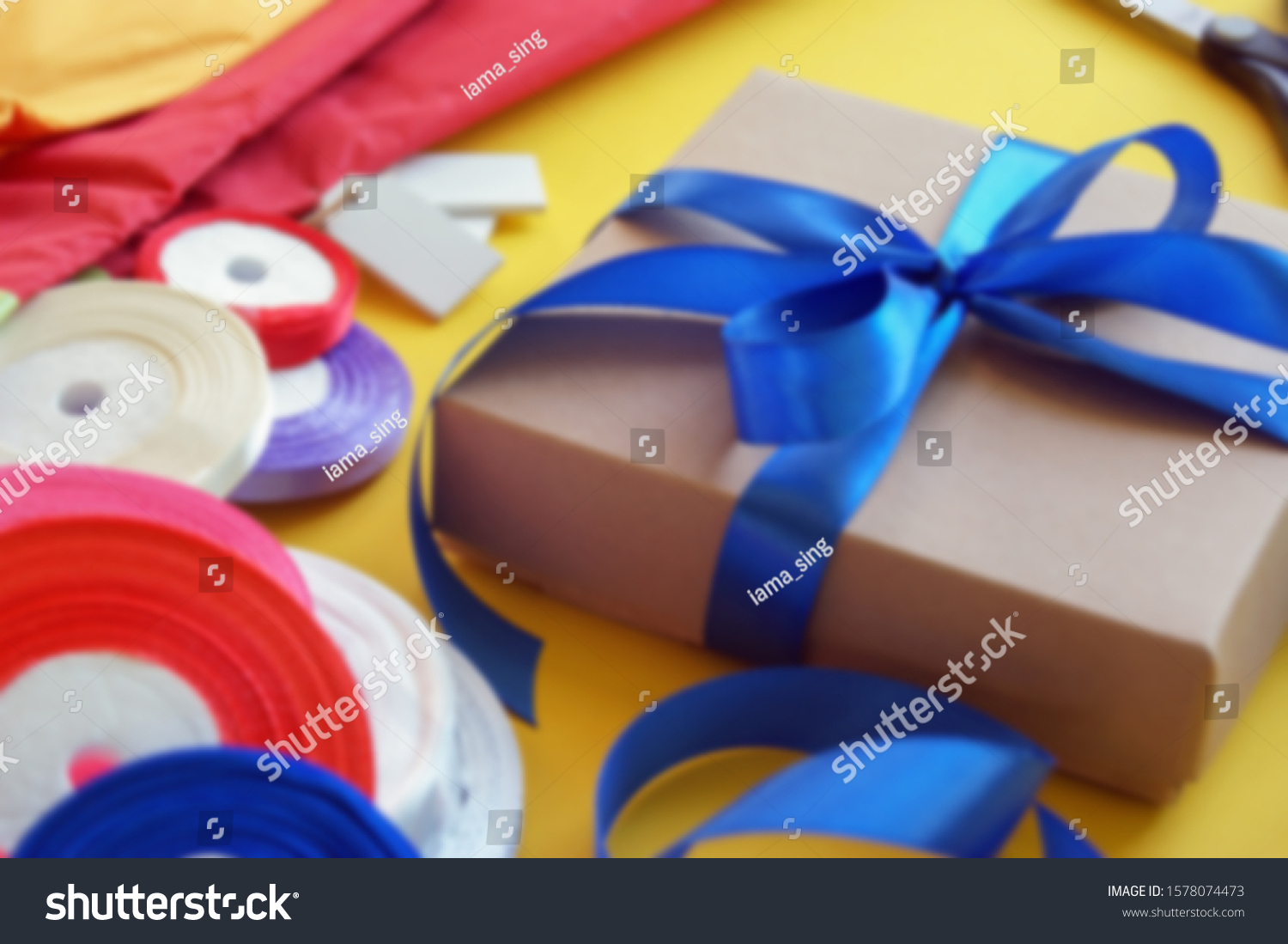 Download Gift Box Packaging On Yellow Background Backgrounds Textures Stock Image 1578074473 PSD Mockup Templates