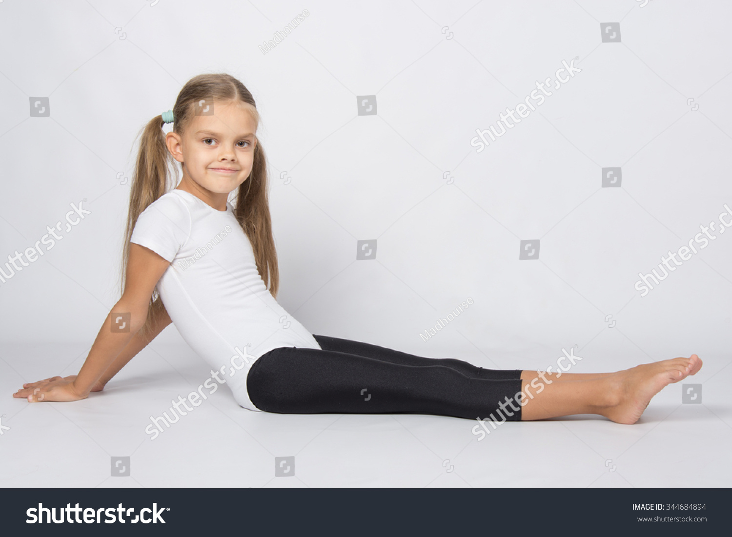 Girl Gymnast Sitting On Floor Legs Foto Stock 344684894 Shutterstock 