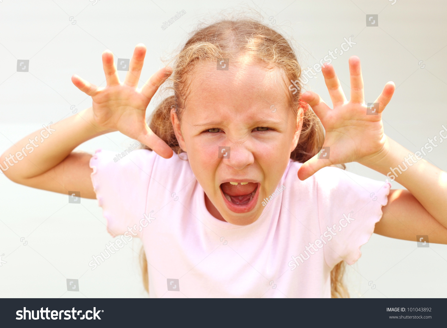 Girl Makes A Grimace On His Face Stock Photo 101043892 : Shutterstock