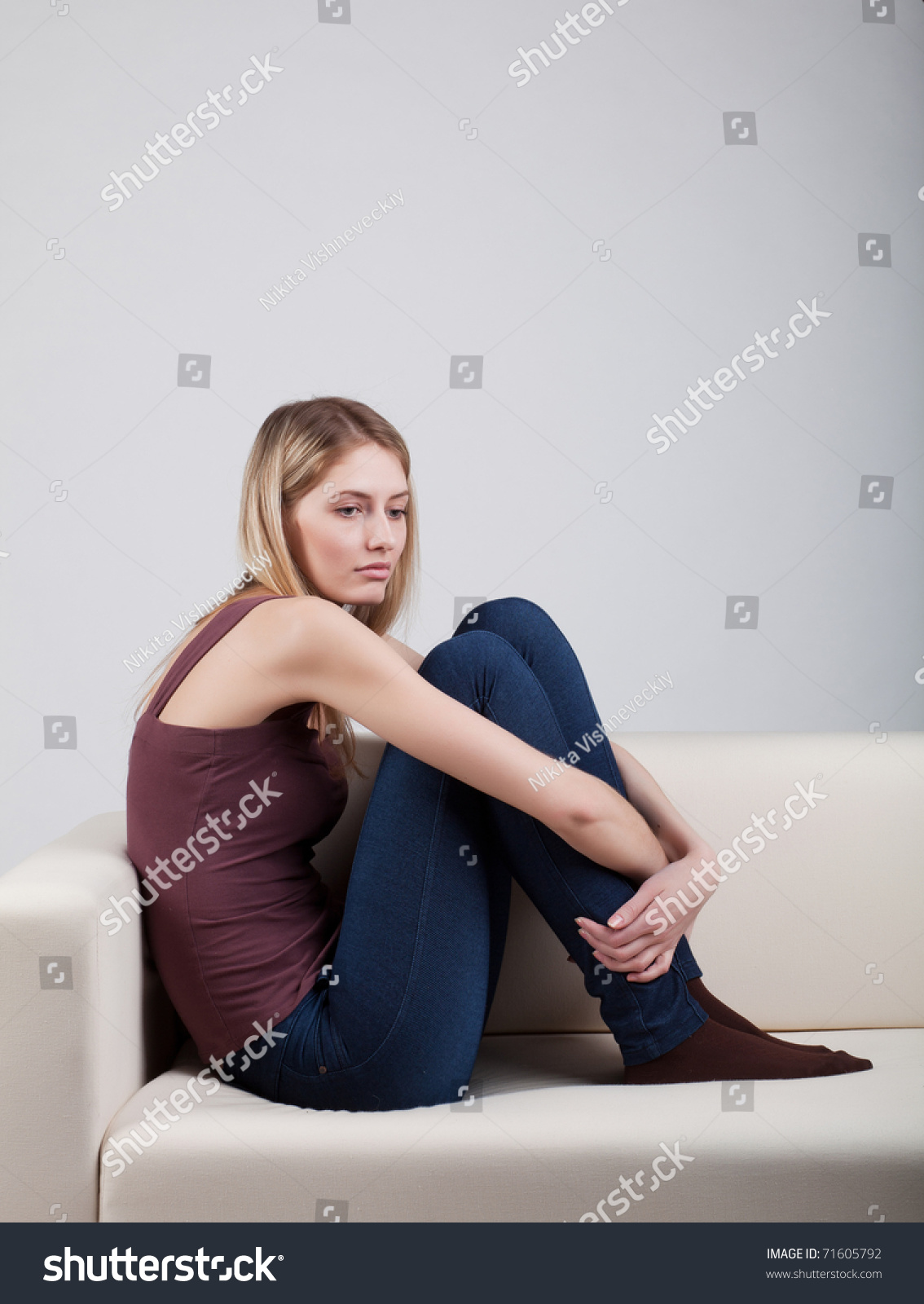 Girl Sitting On Sofa Hugging His Stock Photo 71605792 - Shutterstock