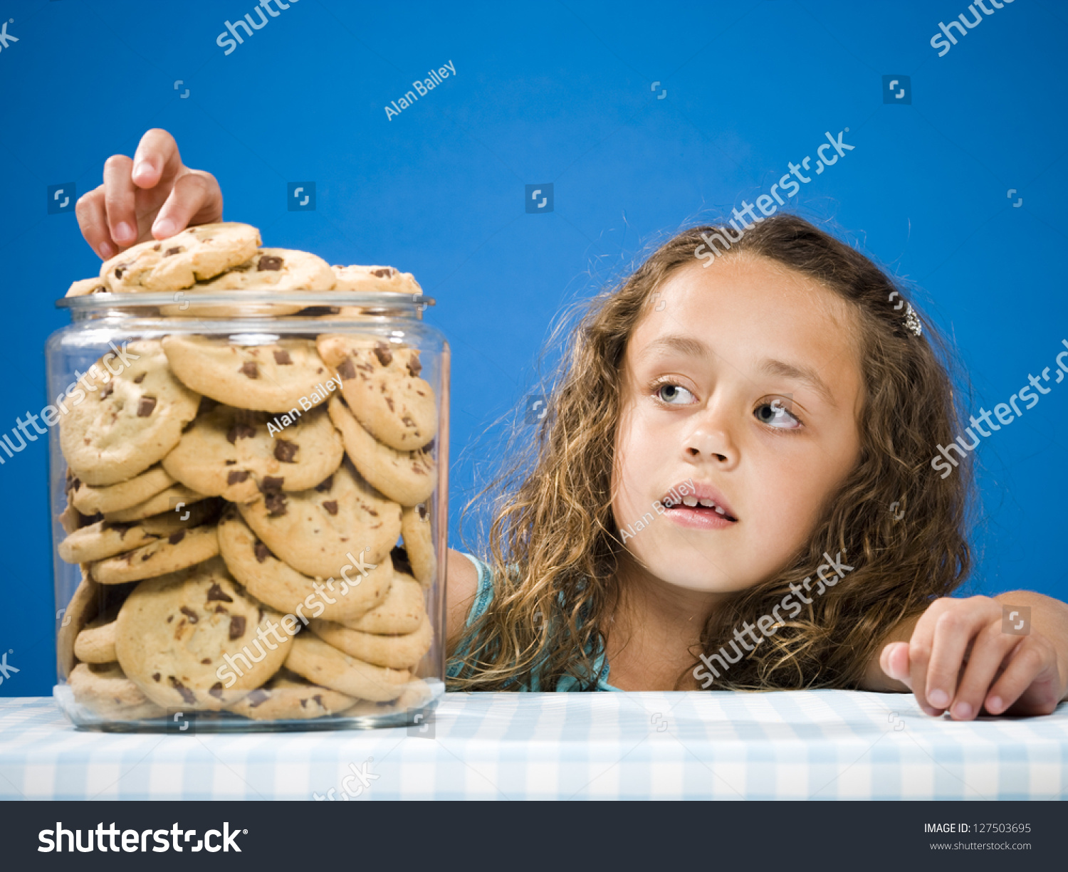 Girl Taking Chocolate Chip Cookie From Jar Stock Photo 127503695 ...