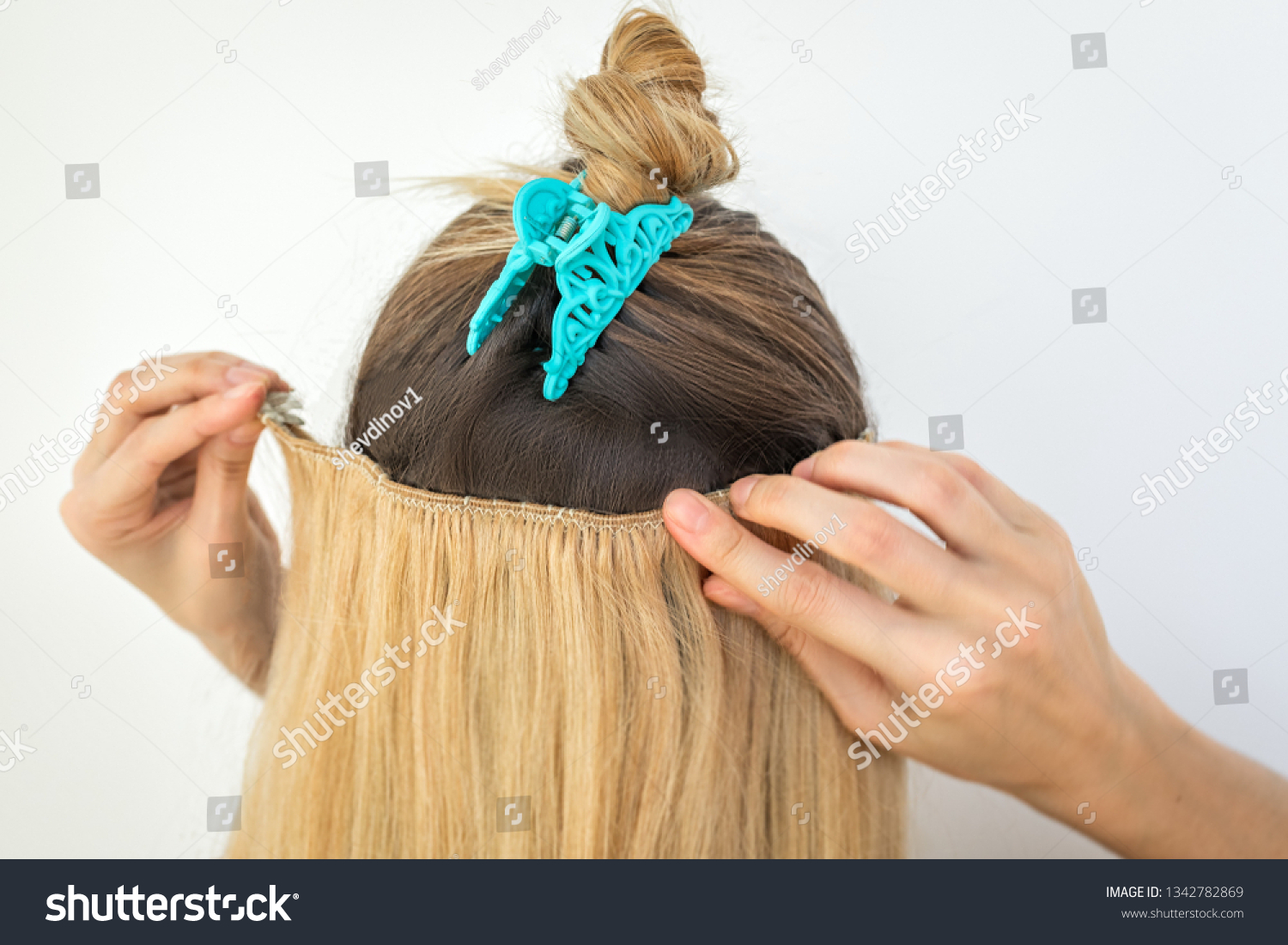 Girl Tries On Blonde Remy Clip Stock Photo Edit Now 1342782869