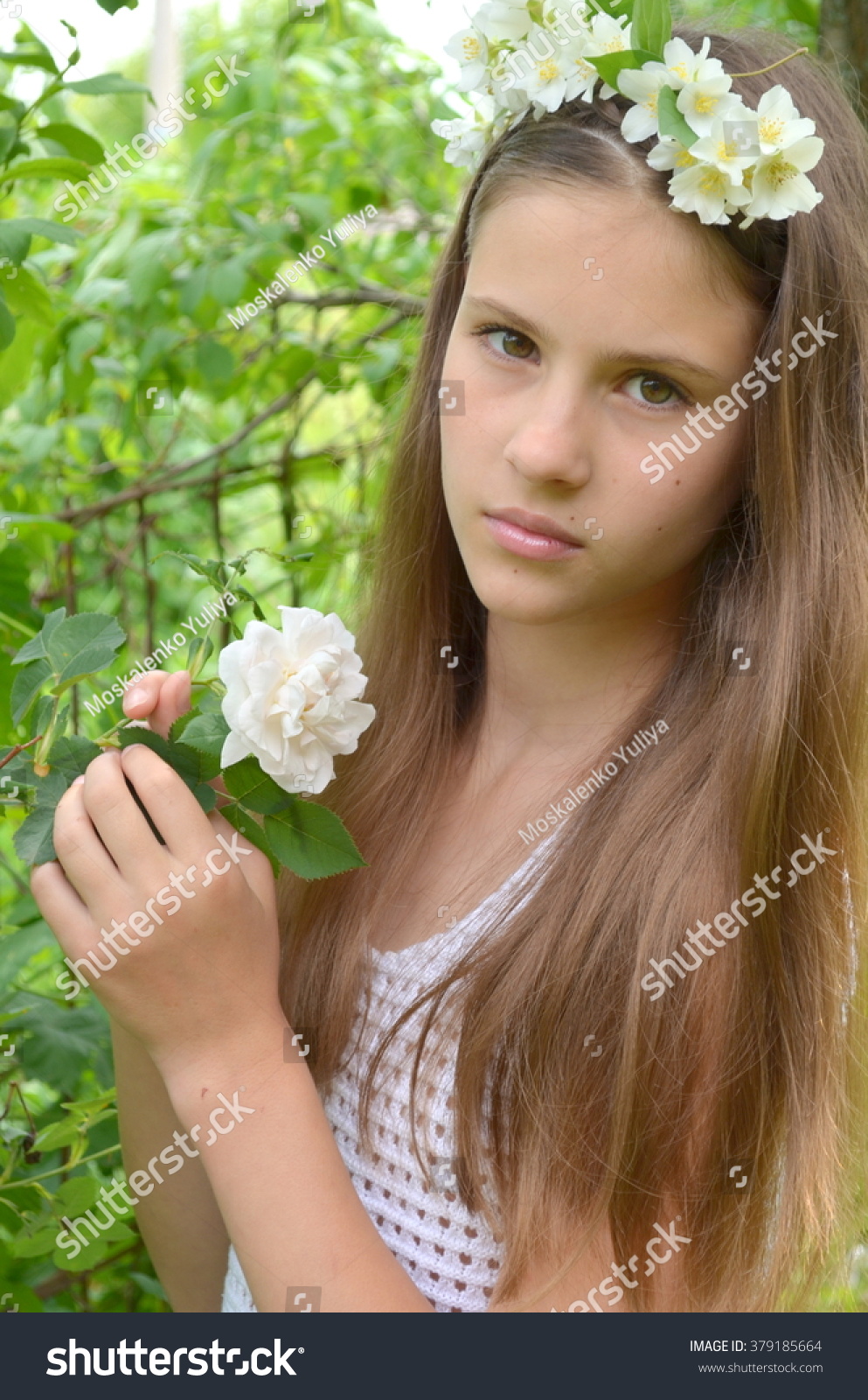 Girl With A Flower Wreath On Head With Live Jasmine Flowers Girl With A Flower Wreath On Head With Live Jasmine Flowers