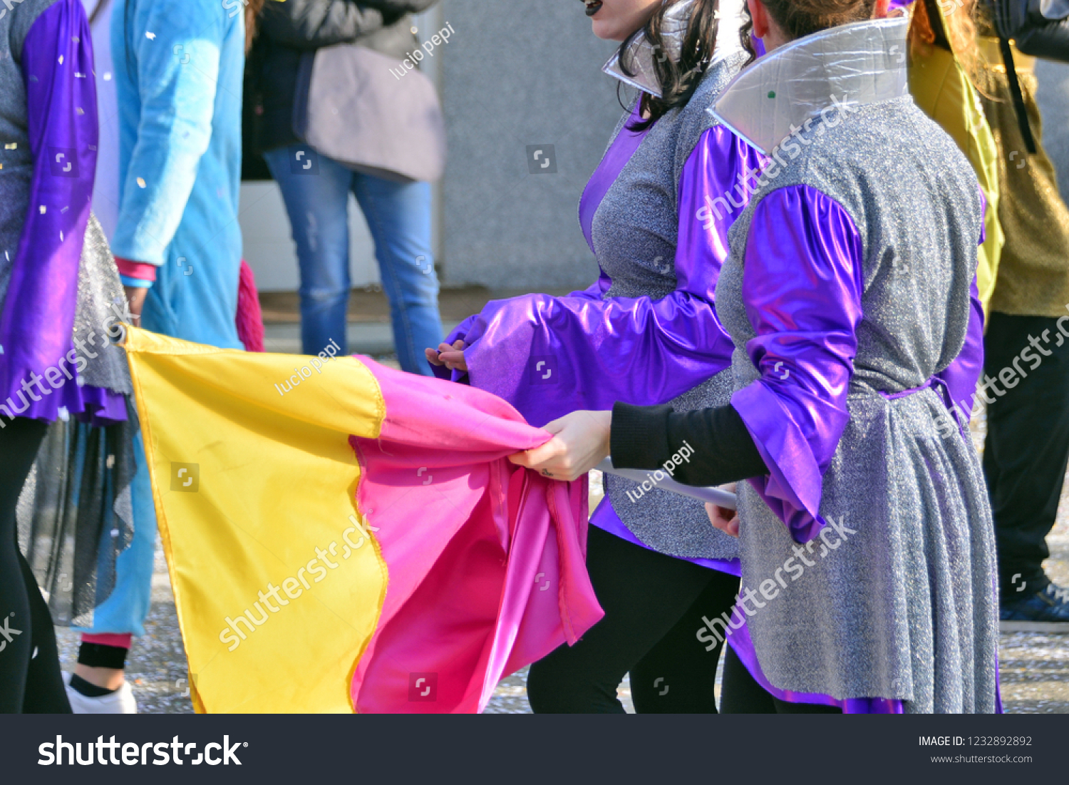 girls-walk-down-street-during-carnival-stock-photo-edit-now-1232892892