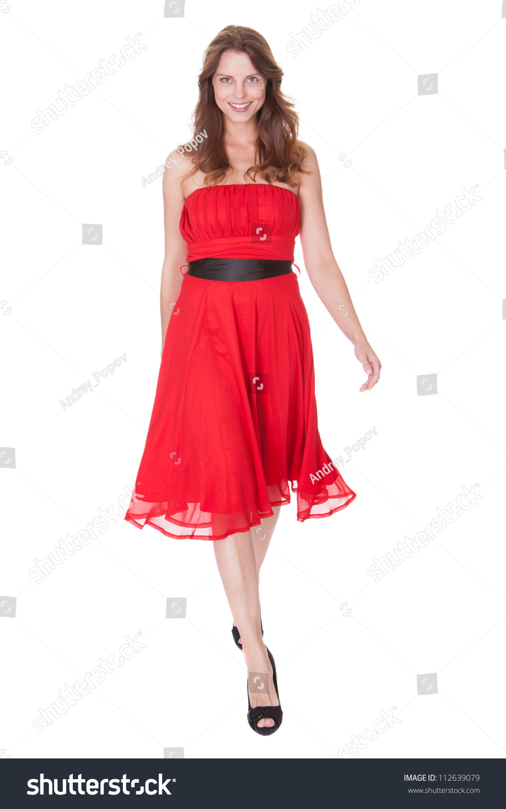 Glamorous Elegant Woman In A Trendy Red Dress Walking Towards The ...