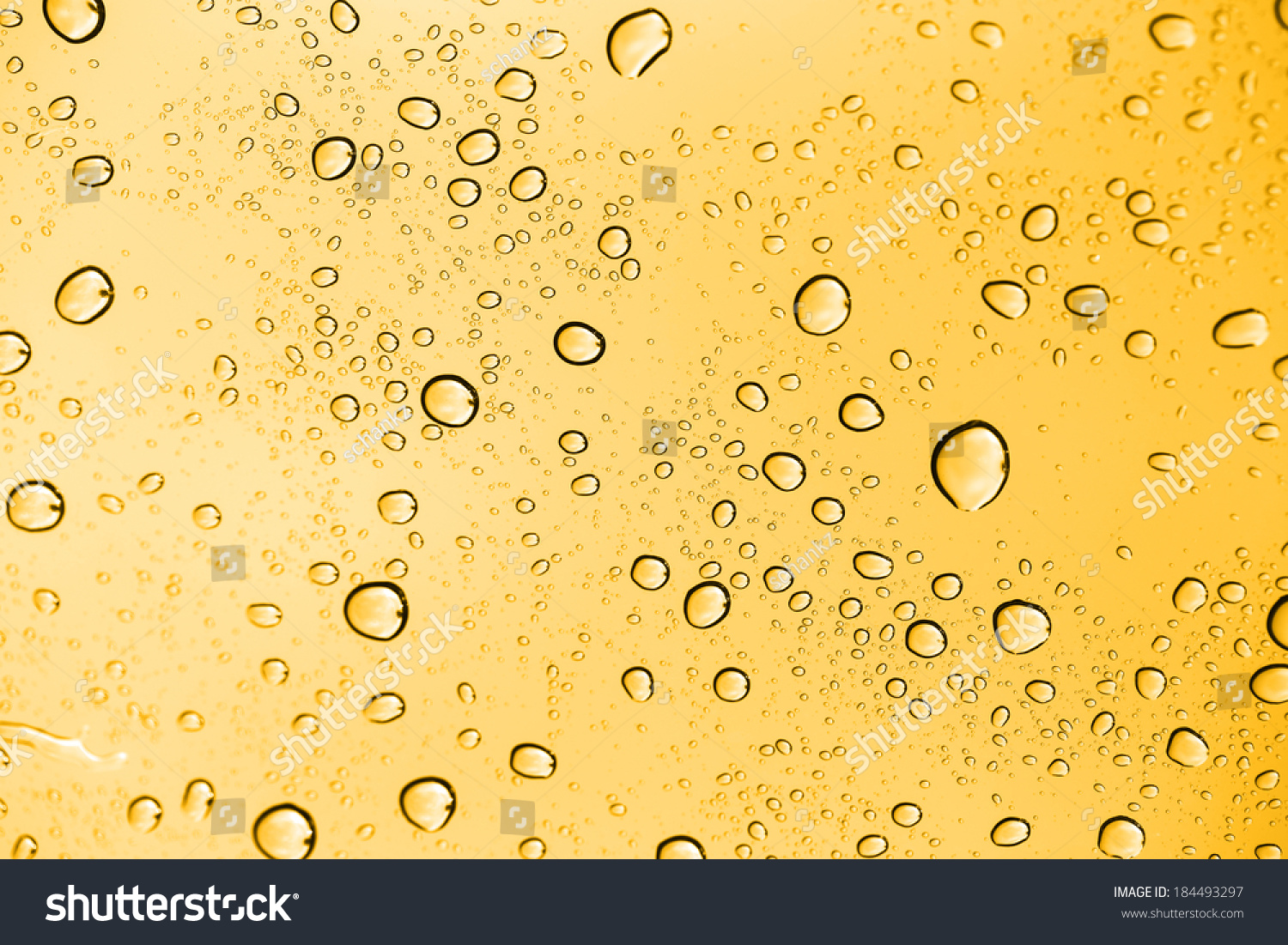 Golden Water Drops On Glass Stock Photo (Edit Now) 184493297