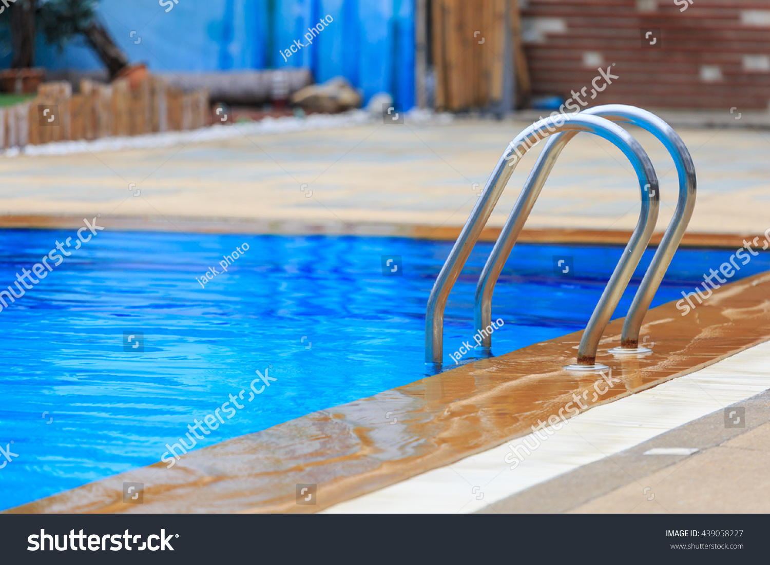 Grab Bars Ladder In The Blue Swimming Pool Stock Photo 439058227 ...