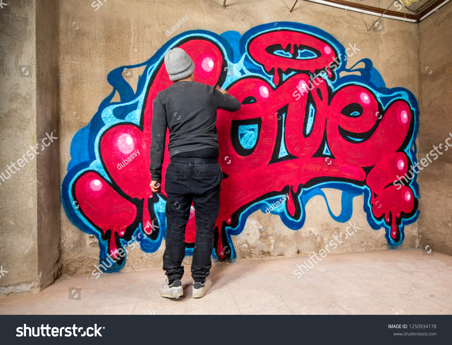 Graffiti Artist Spraying Word Love On Stock Photo Edit Now