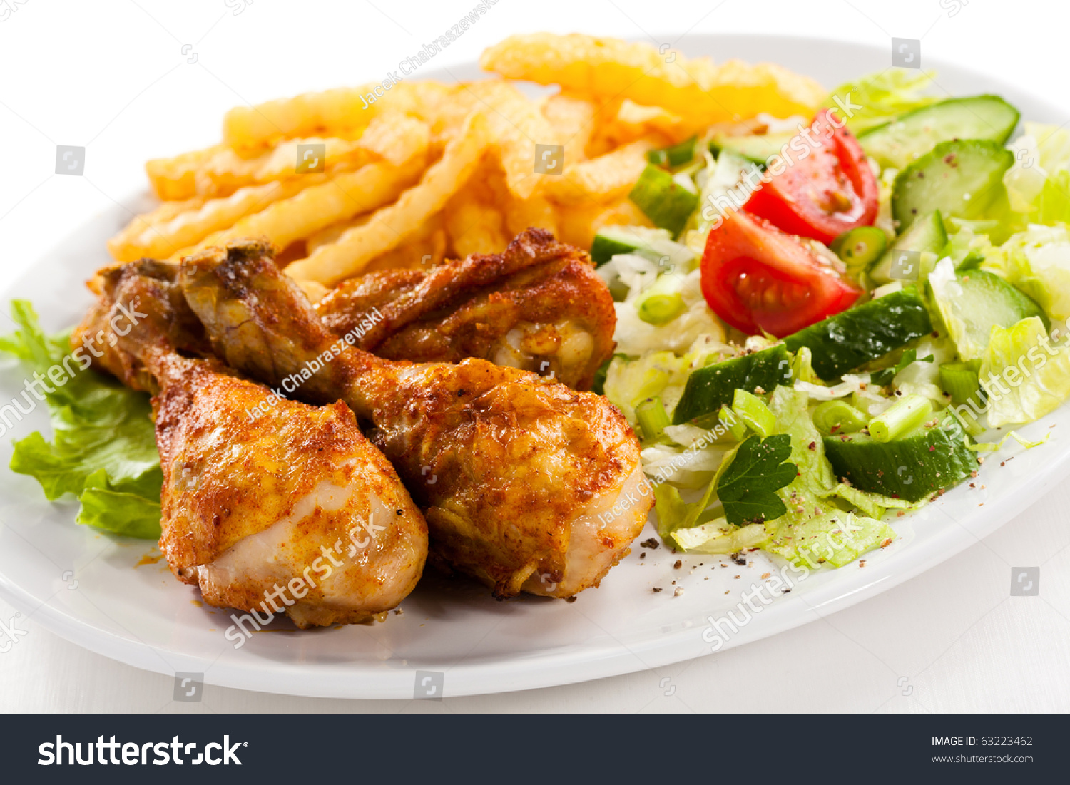 Grilled Chicken Drumstick, French Fries And Vegetables Stock Photo ...