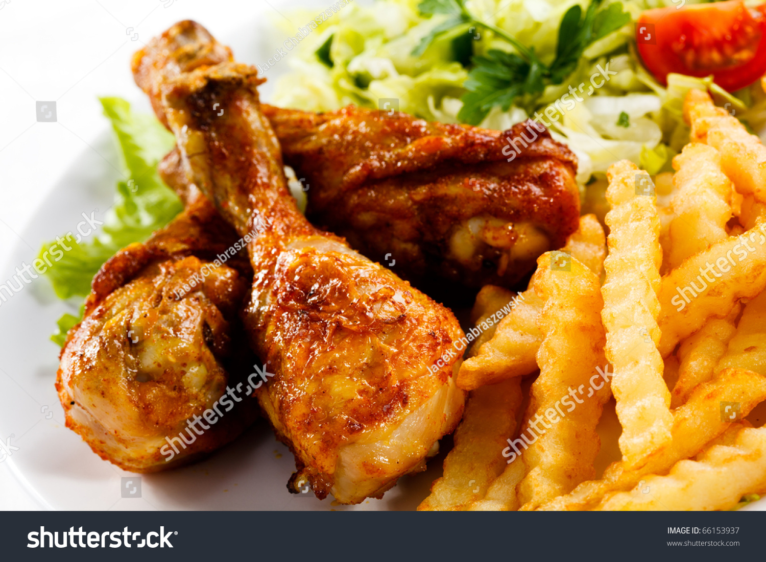 Grilled Chicken Drumstick, French Fries And Vegetables Stock Photo ...