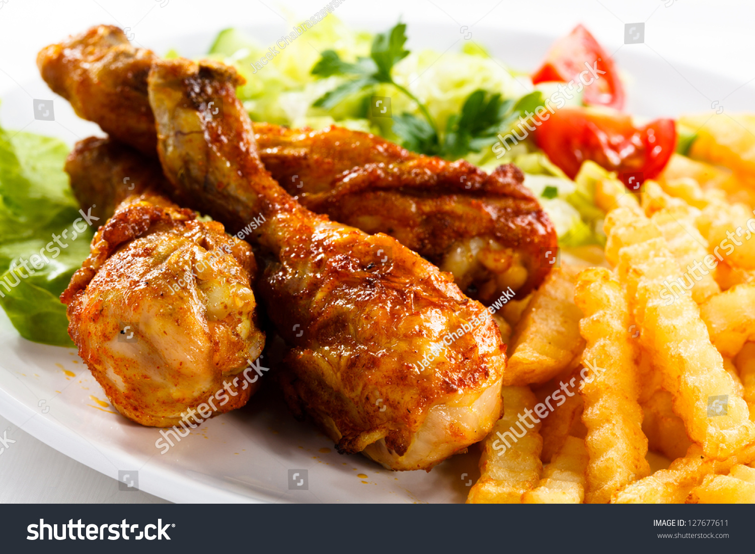 Grilled Chicken Legs With Chips And Vegetables Stock Photo 127677611 ...
