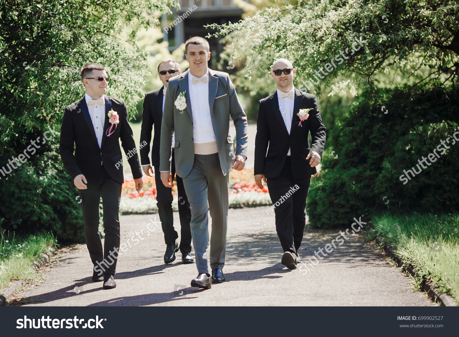 groom in gray suit groomsmen black