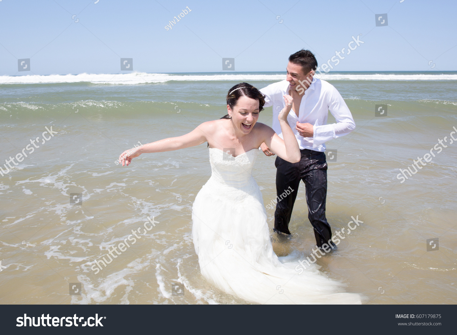 Groom Bride Plays Water After Wedding Stock Photo Edit Now 607179875