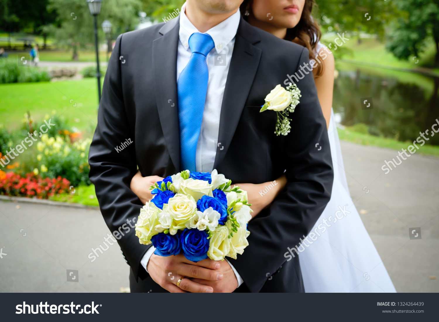 black suit blue tie wedding