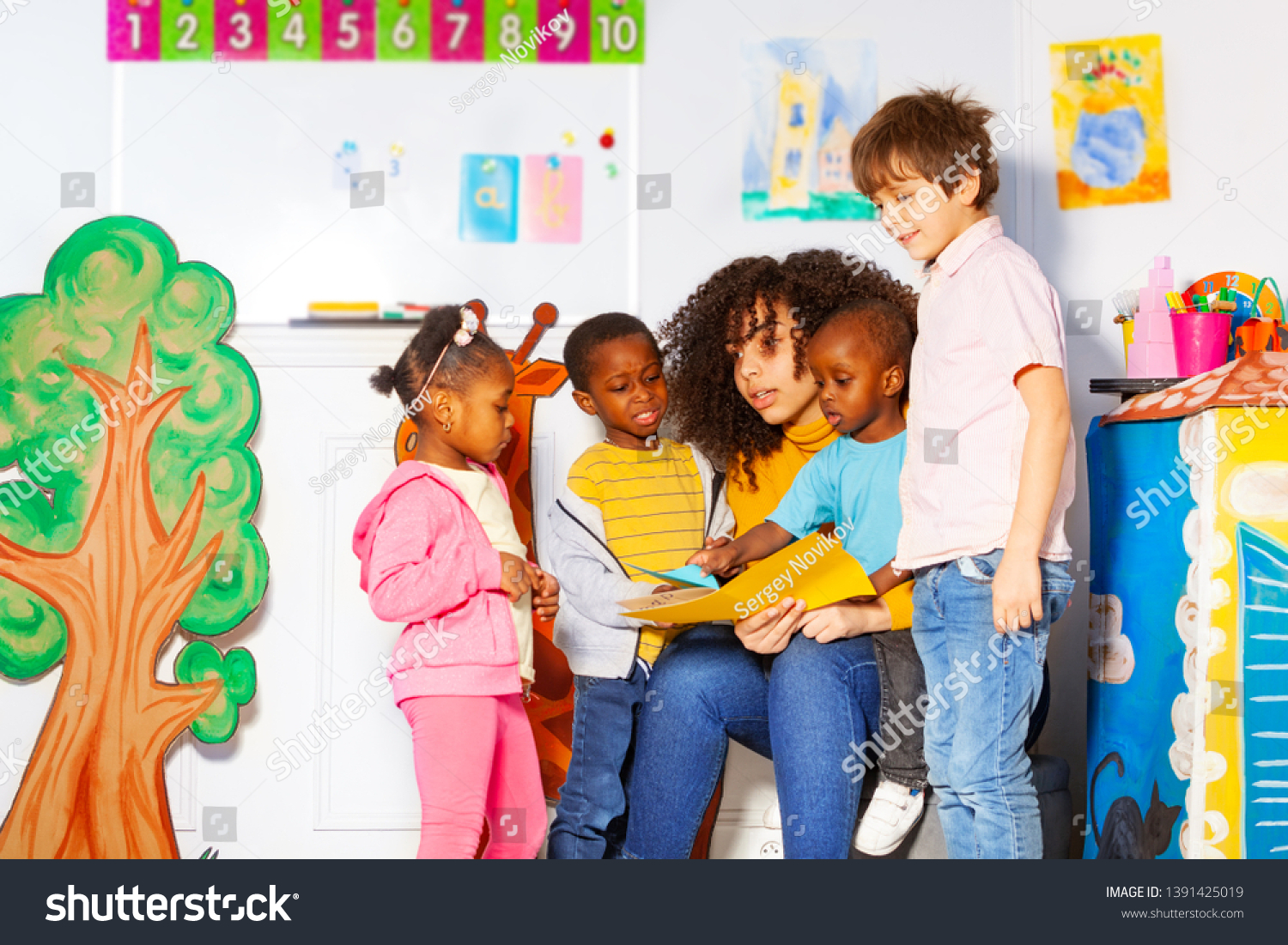 Group Kids Reading Book Teacher Nursery Stock Photo 1391425019 ...