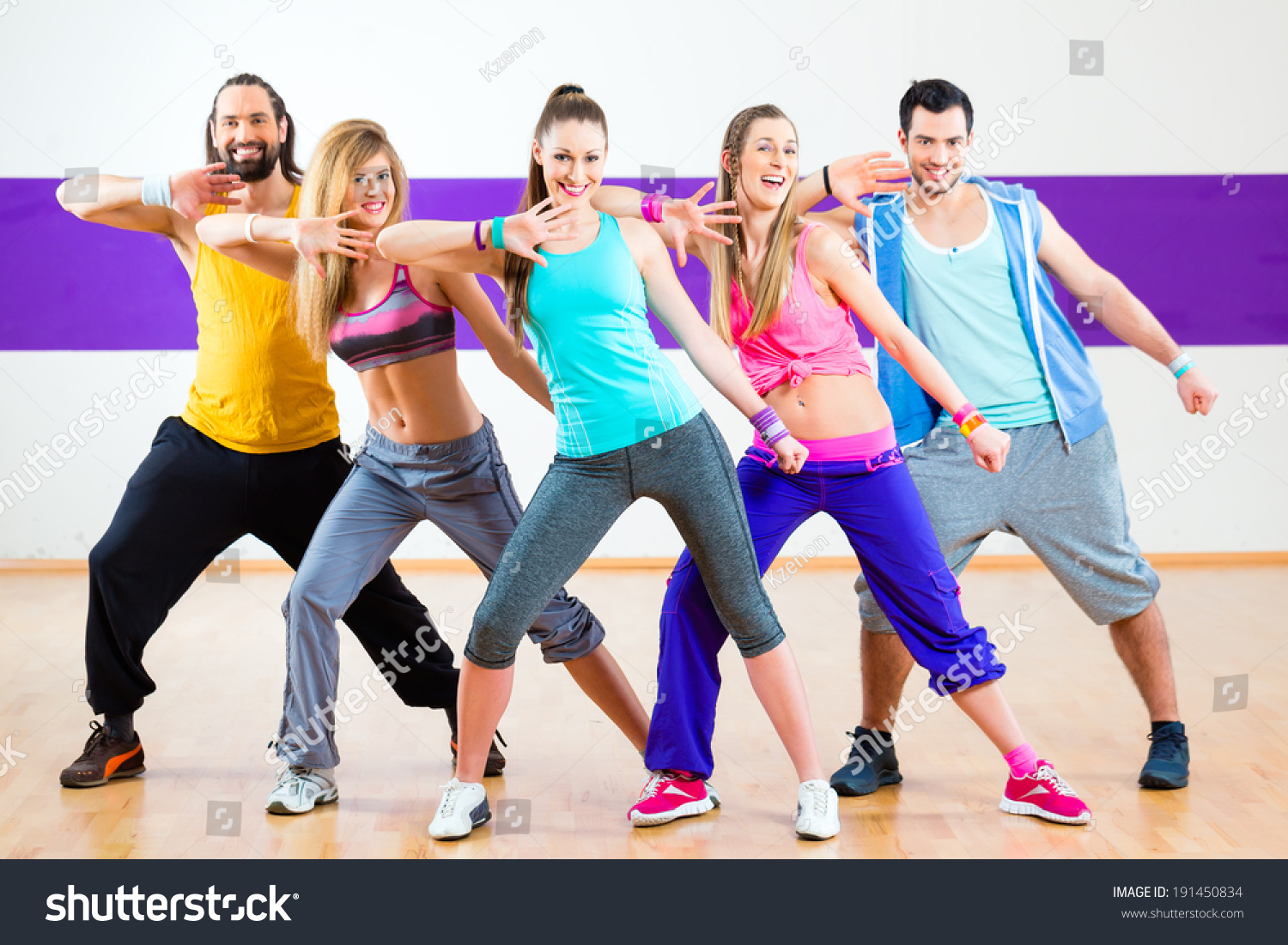 Group Of Men And Women Dancing Zumba Fitness Choreography In Dance ...