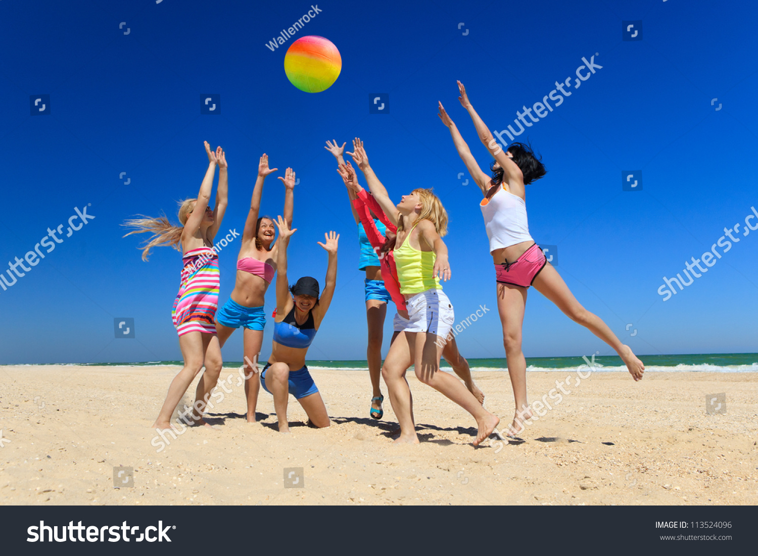 young girls playing volleyball