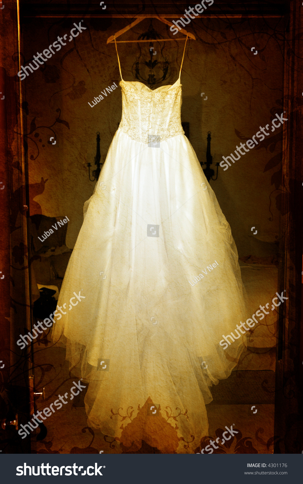 Grunge Wedding Dress With Tulle Skirt Hanging In A Doorway On Swirls ...
