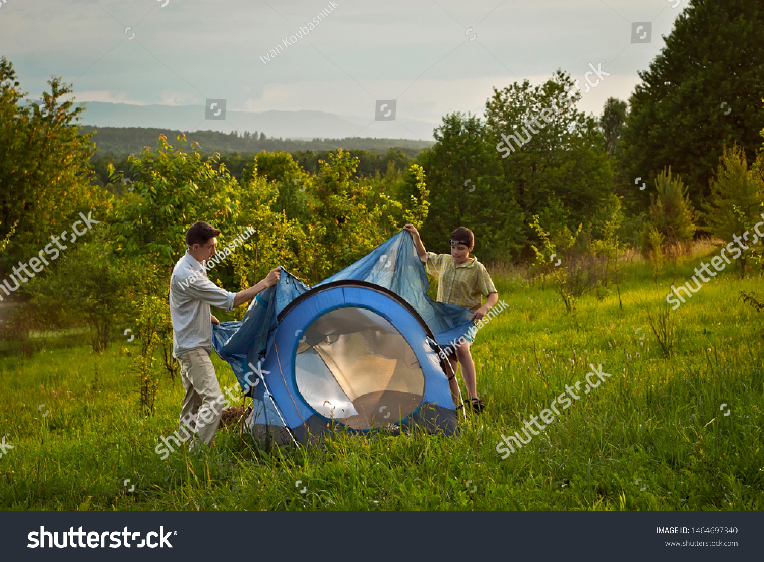 Guys Lay Tent On Grass Man Stock Photo Edit Now 1464697340