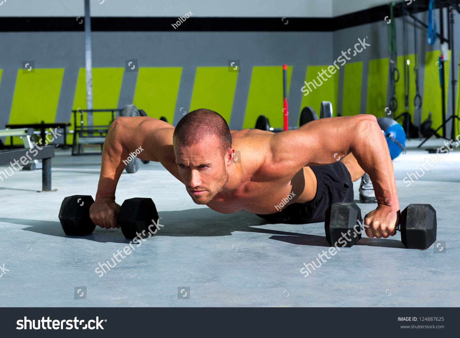 Gym Man Push-Up Strength Pushup Exercise With Dumbbell In A Workout ...