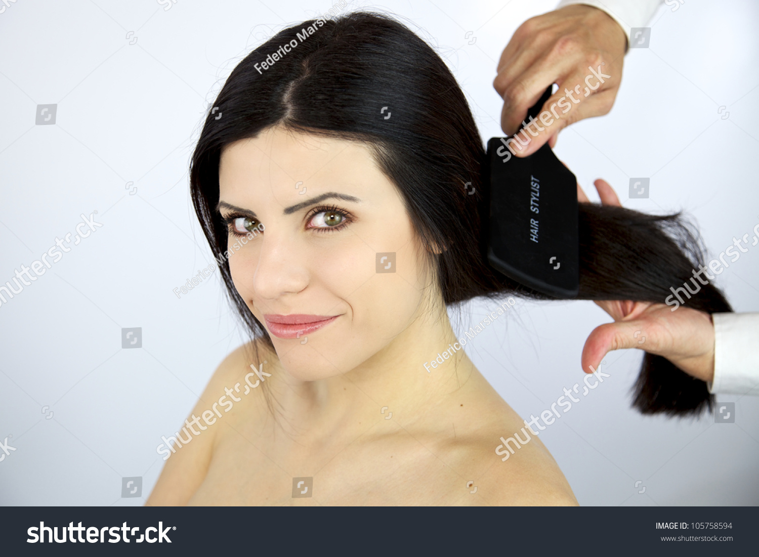 Hairdresser Brushing Long Black Hair Of Sexy Female Model Stock Photo ...