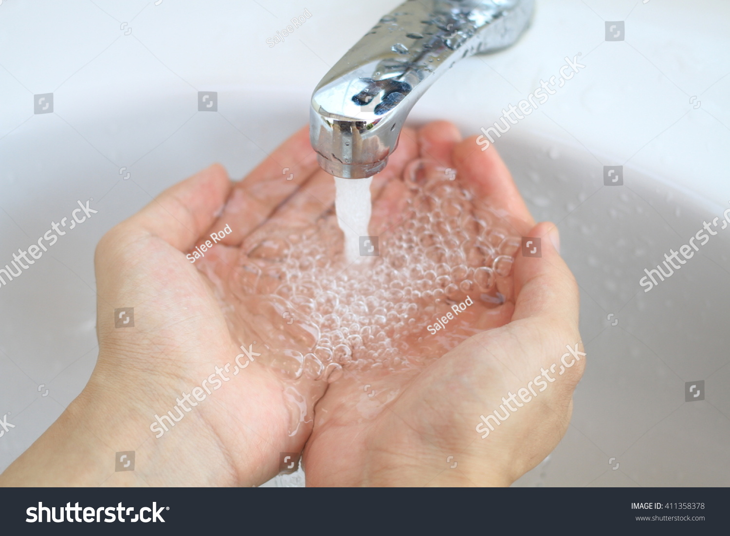 Hand Cupping Water Droplets Water Faucet Stock Photo 411358378