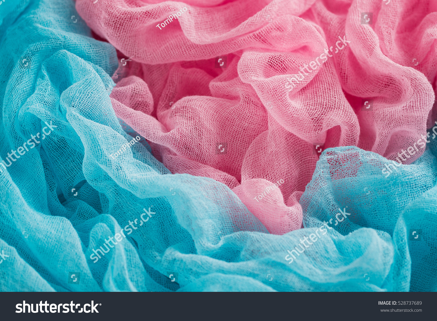 https://www.shutterstock.com/pic-528737689/stock-photo-hand-dyed-blue-and-pink-gauze-fabric-colorful-cloth-texture-background.html