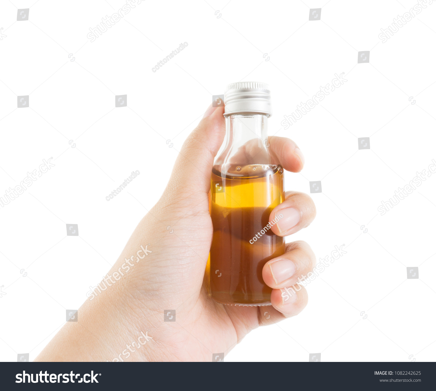 Download Hand Grab Bottle Yellow Sweet Fresh Stock Photo Edit Now 1082242625 PSD Mockup Templates