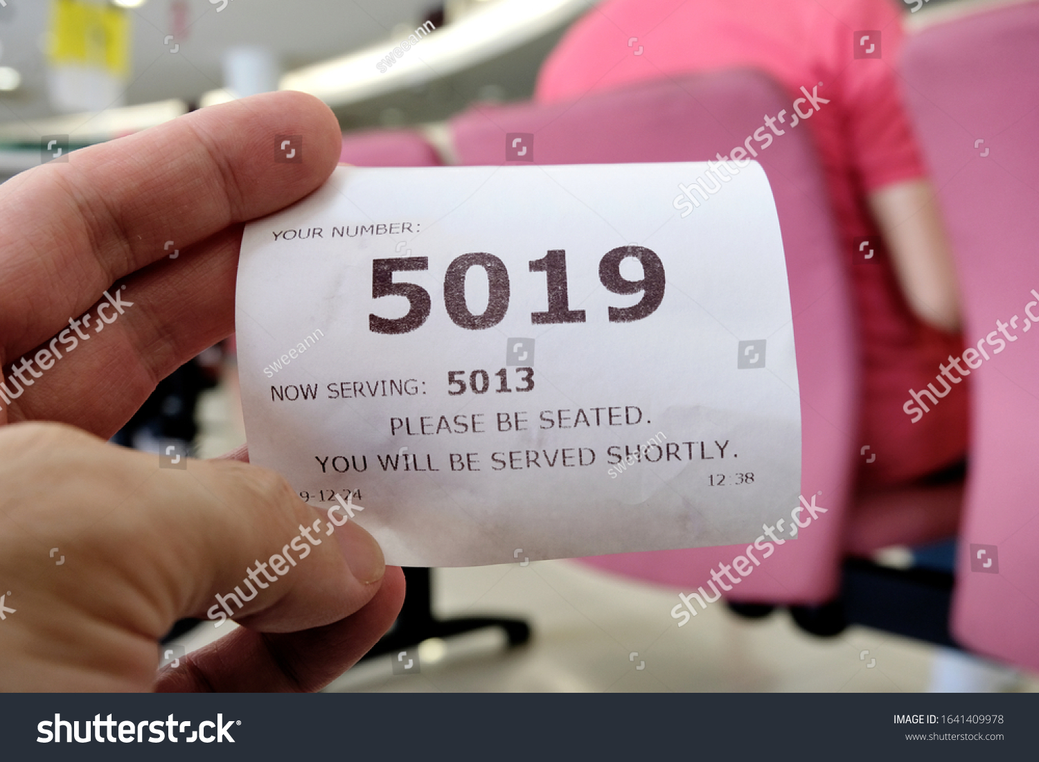 Hand Holding Queue Number Ticket Counter: foto de stock (editar ahora ...