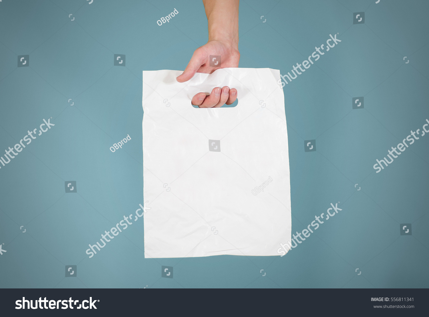 Download Hand Shows White Blank Plastic Bag Stock Photo 556811341 ...