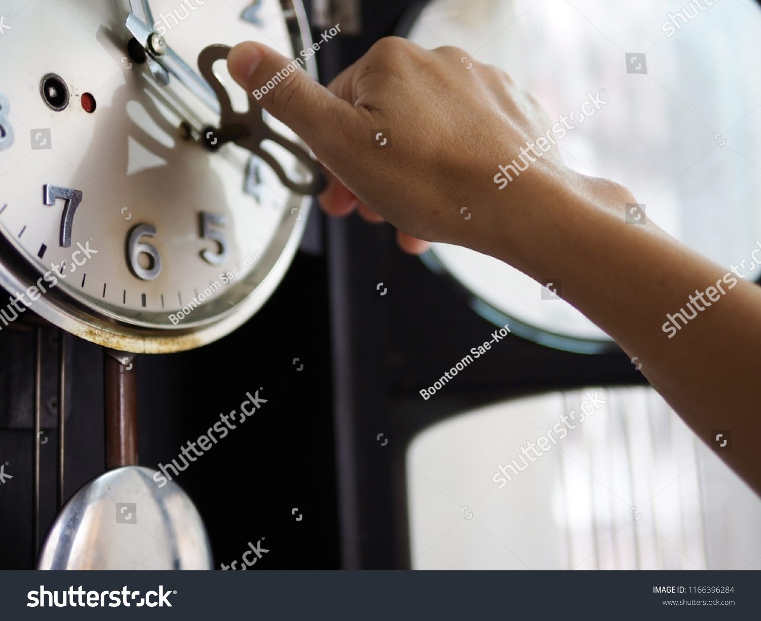 Hand Using Key Wind Antique Wall Stock Photo Edit Now 1166396284