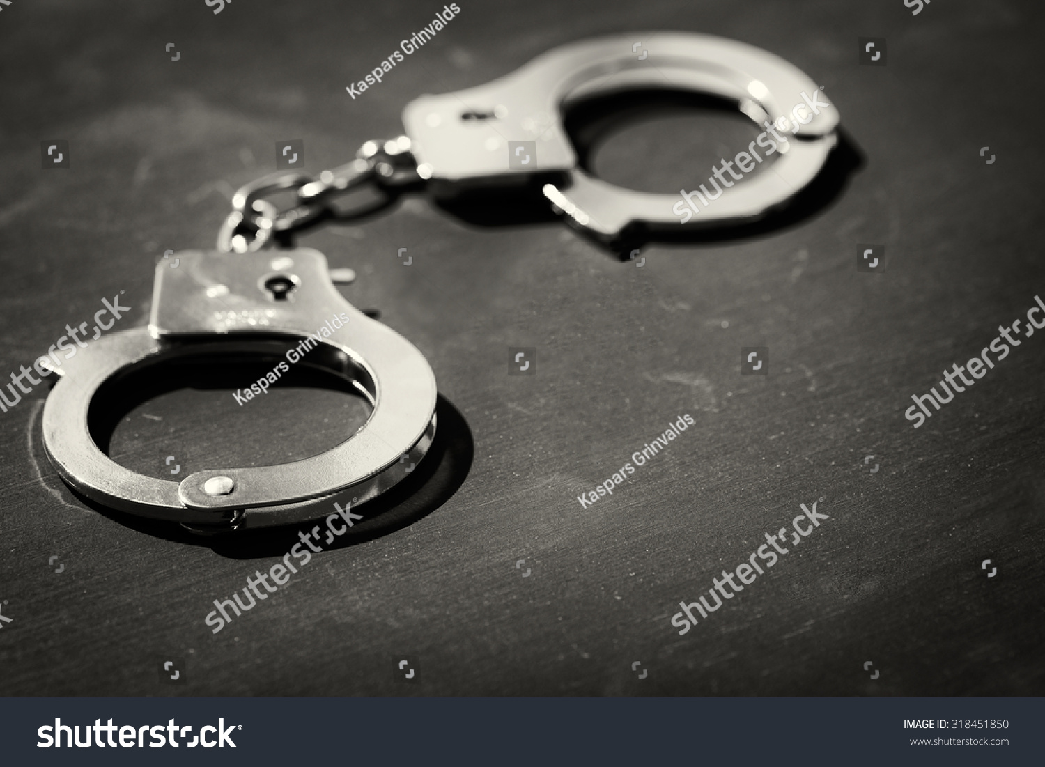 Handcuffs On Black Background Stock Photo 318451850 - Shutterstock