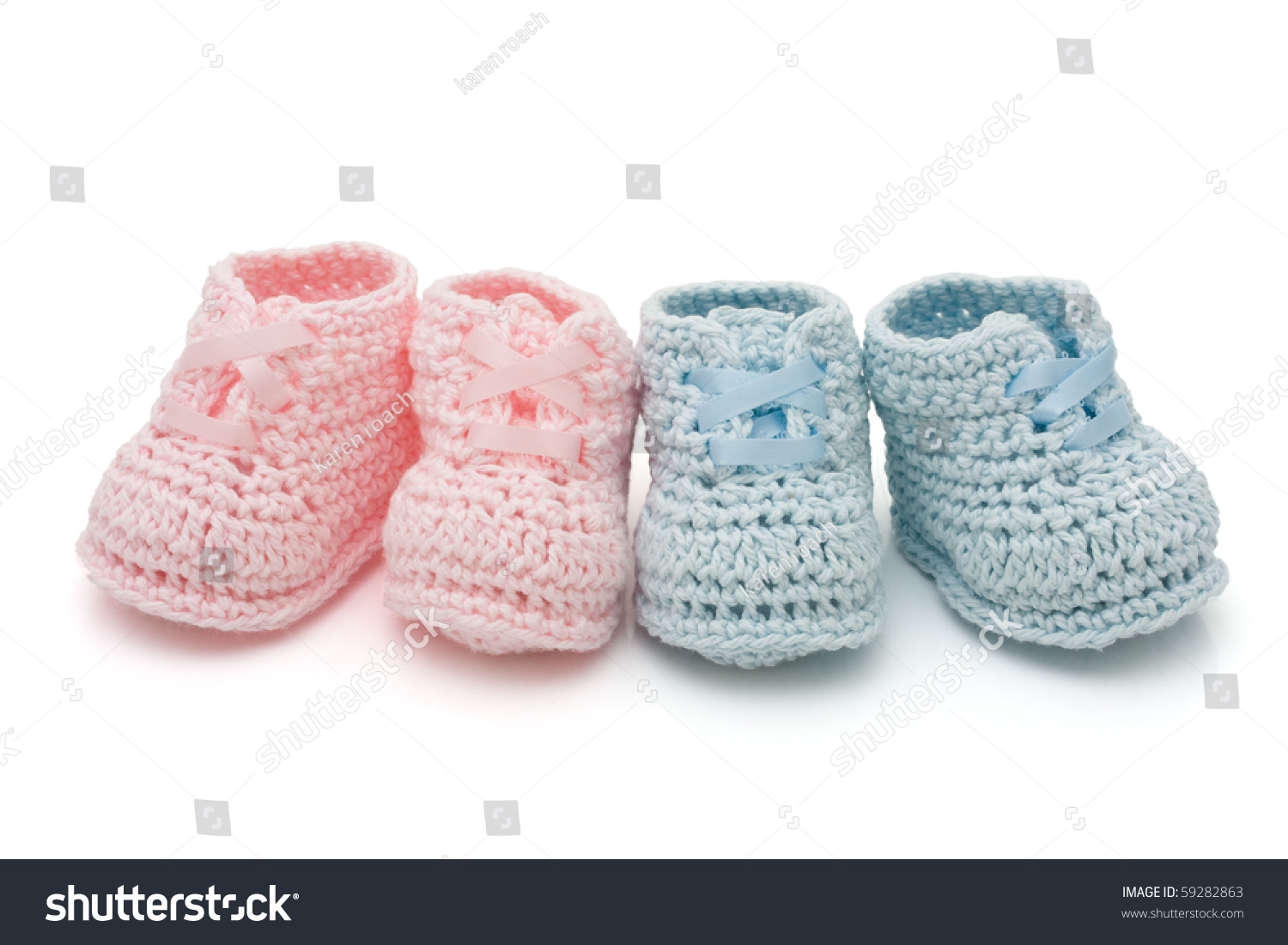 Handmade Pink And Blue Baby Booties Isolated On A White Background ...