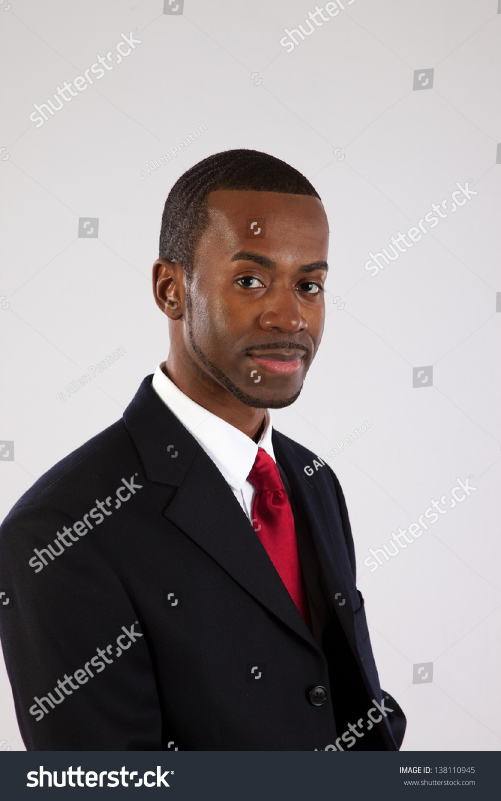 Handsome Black Businessman Looking At The Camera With A Smirk Of A ...
