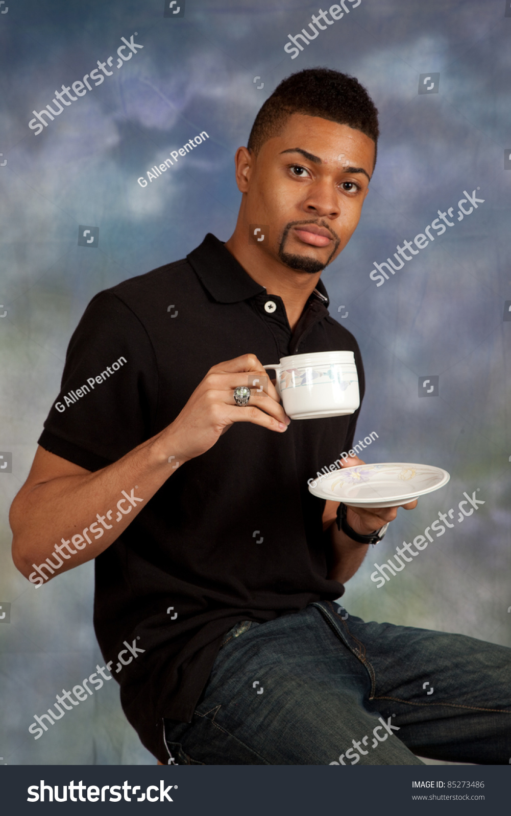 Handsome Black Man Drinking Coffee Or Tea With Eye Contact Stock Photo ...