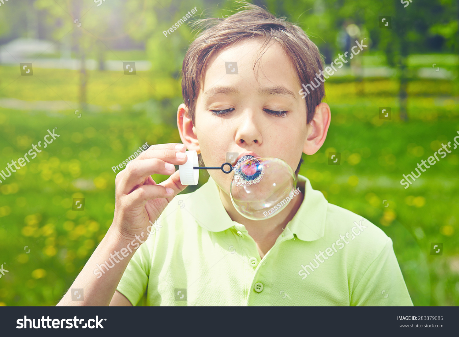 Handsome Boy Blowing Soap Bubbles Park Stock Photo 283879085 | Shutterstock