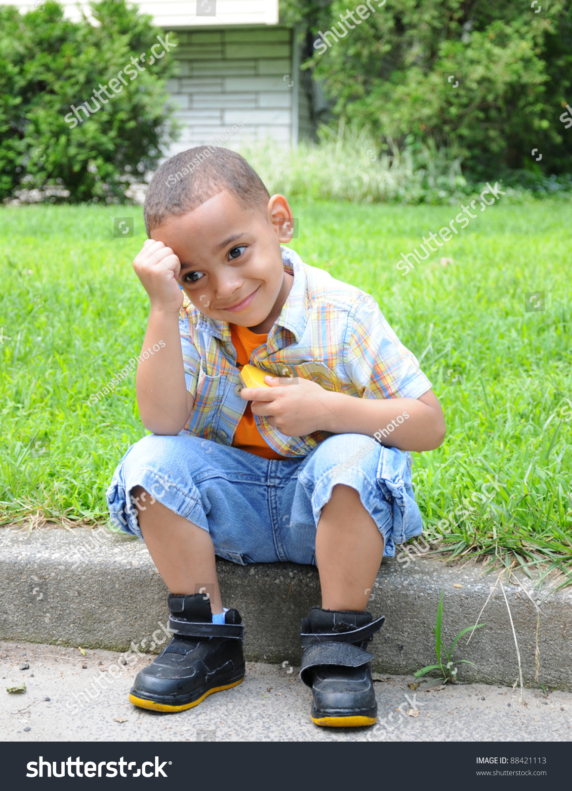 handsome-little-boy-daydreaming-smiling-hand-stock-photo-edit-now