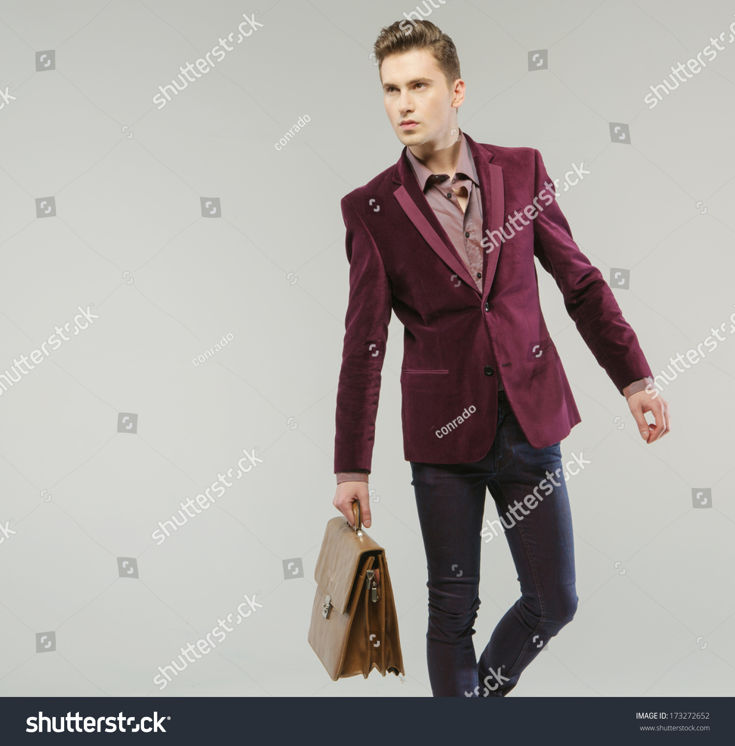 man carrying handbag