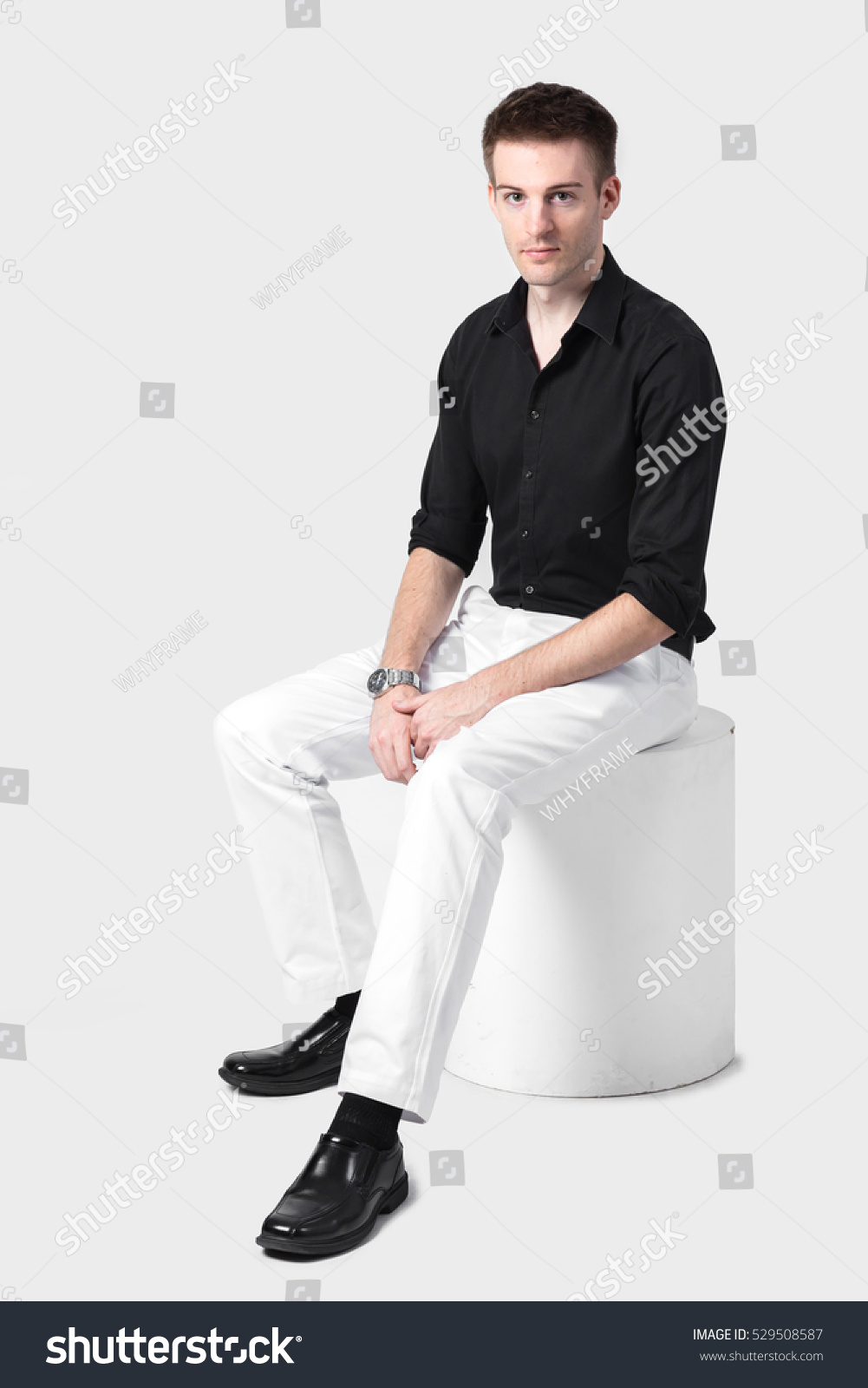 black shirt and white pants