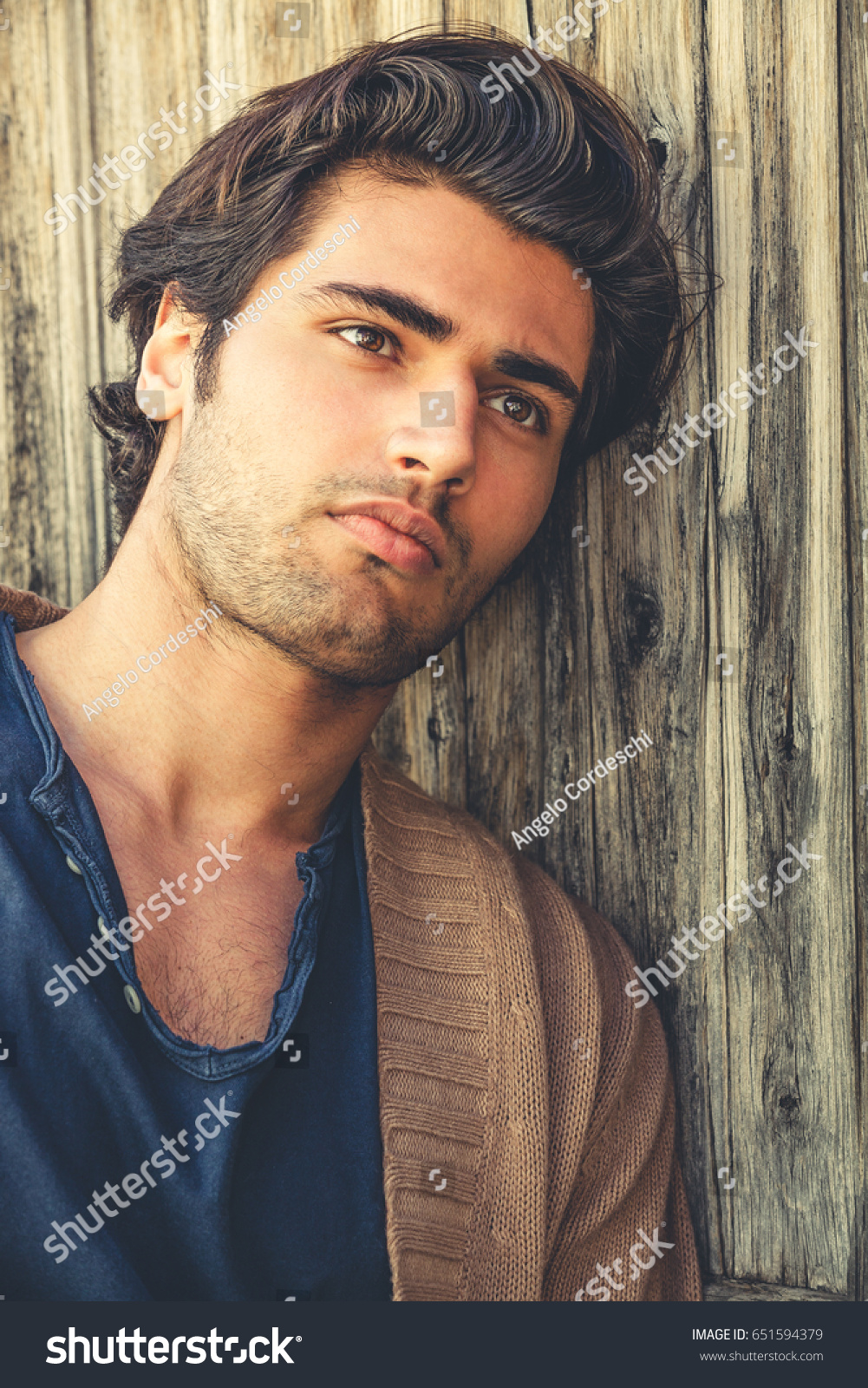 Handsome Man Relaxing Leaning Wooden Wall Stock Photo 651594379