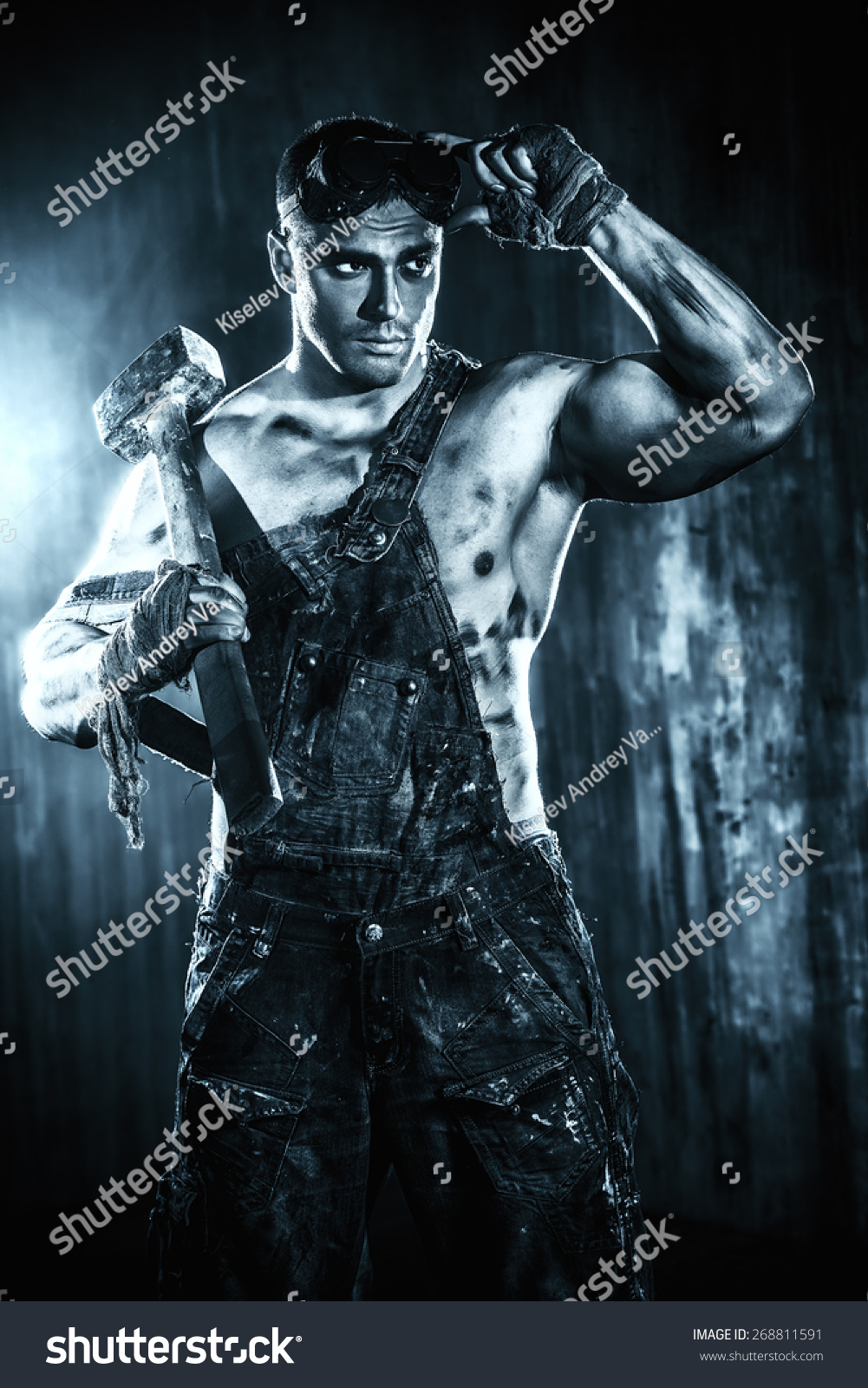 Handsome Muscular Coal Miner With A Hammer Over Dark Grunge Background ...