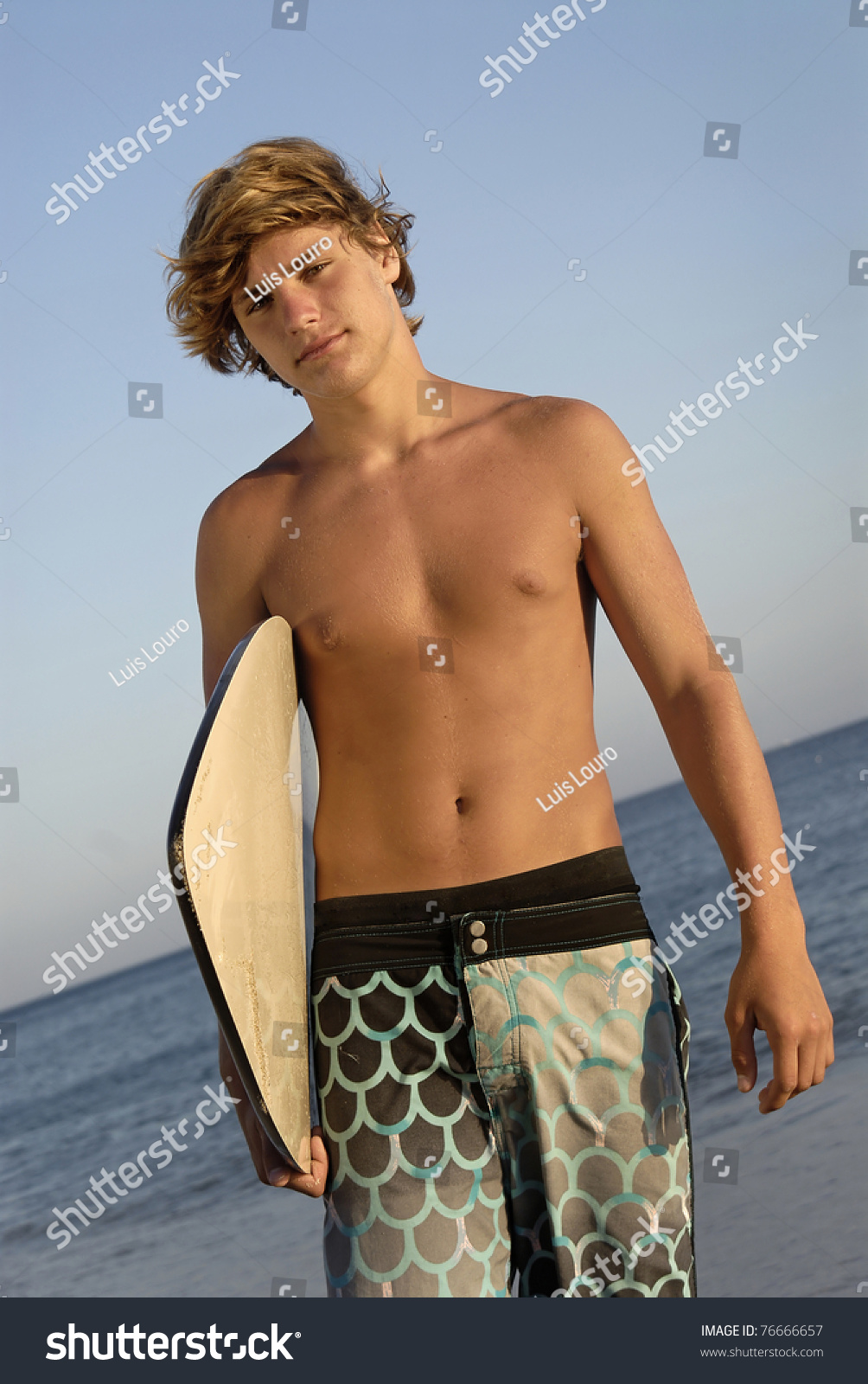 Handsome Surfer Posing In The Beach Stock Photo 76666657 : Shutterstock